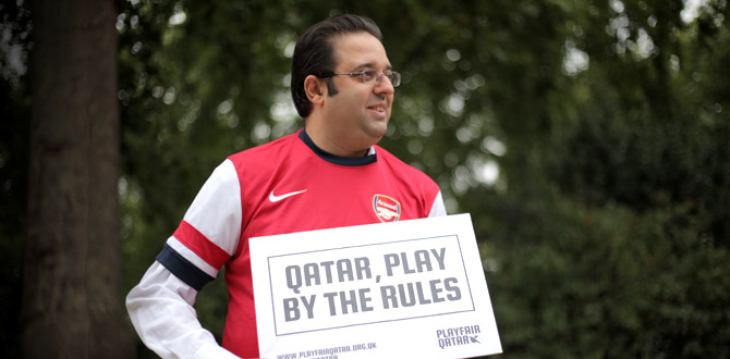 The TUC's ILO delegate Sam Gurney proudly displays his Playfair Qatar sign. 